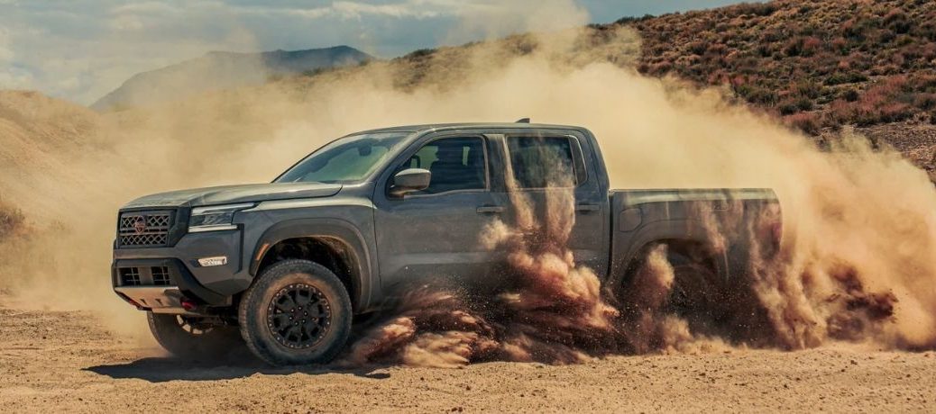 Side view of a 2022 Nissan Frontier on a desert