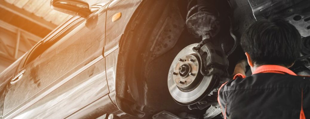 a technician fixing the brake pad
