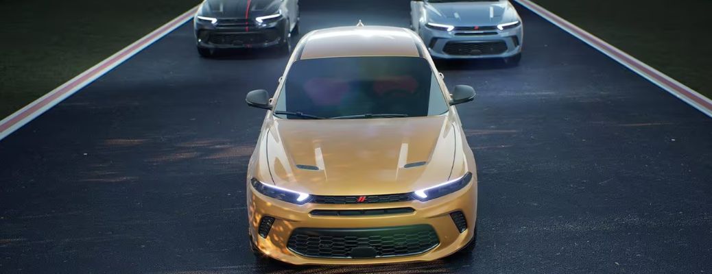 Front view of three 2023 Dodge Hornet SUVs