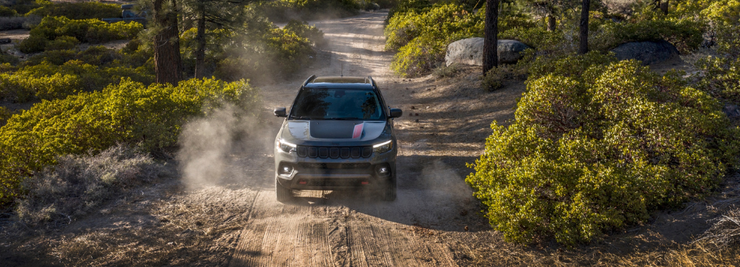 Front view f the 2024 Jeep Compass in forest