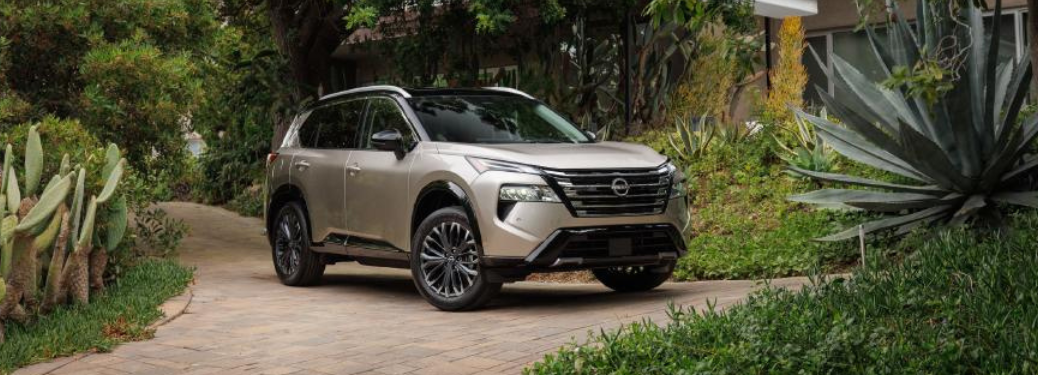 2024 Nissan Rogue surrounded by greenery