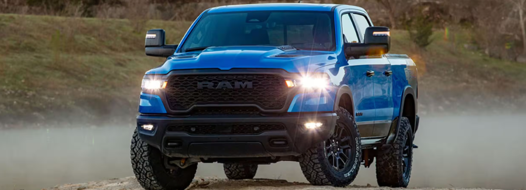 Front view of the 2025 Ram 1500 at night with headlights on