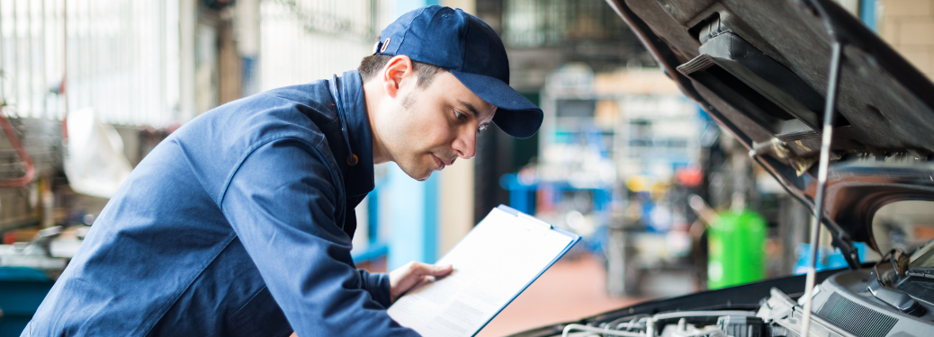 Mechanic inspecting a vehicle