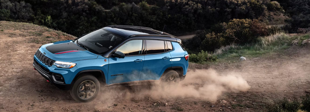 Side view of the 2025 Jeep Compass on rough terrain