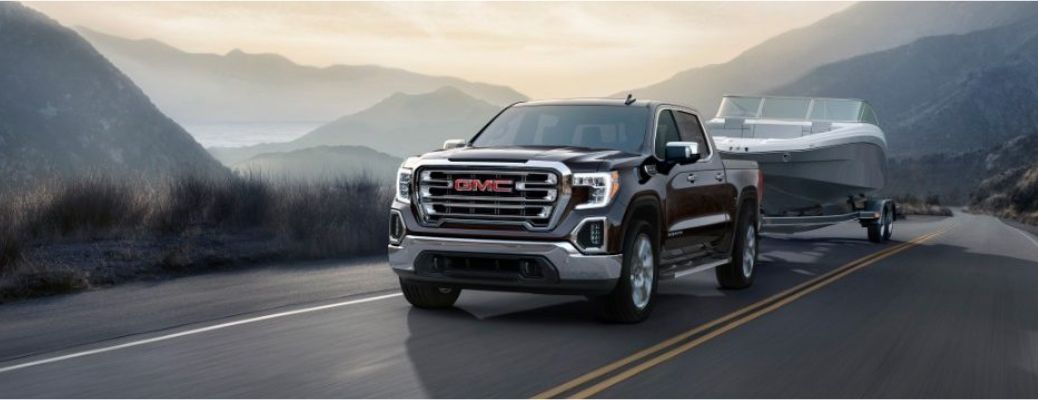 2017 GMC Sierra front quarter view towing a boat