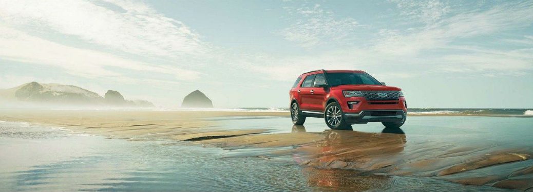 Passenger side exterior view of a red 2018 Ford Explorer