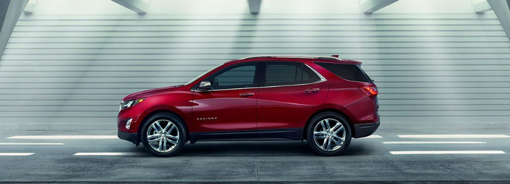 Driver side exterior view o fa red 2018 Chevy Equinox