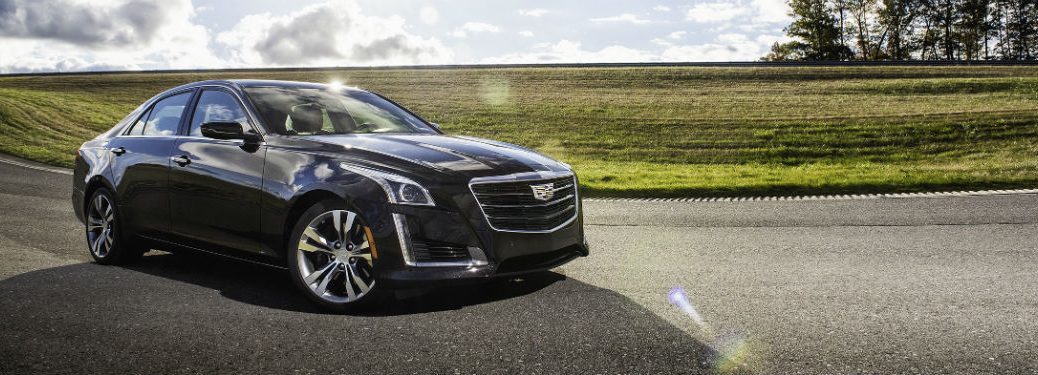 Passenger side exterior view of a black 2018 Cadillac CTS Sedan