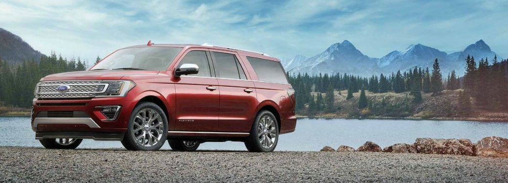 Driver side exterior view of a red 2018 Ford Expedition