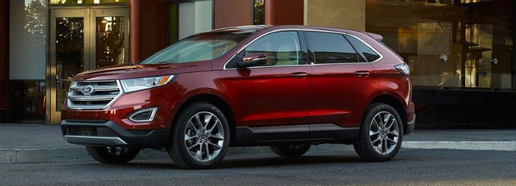 Driver side exterior view of a red 2018 Ford Edge