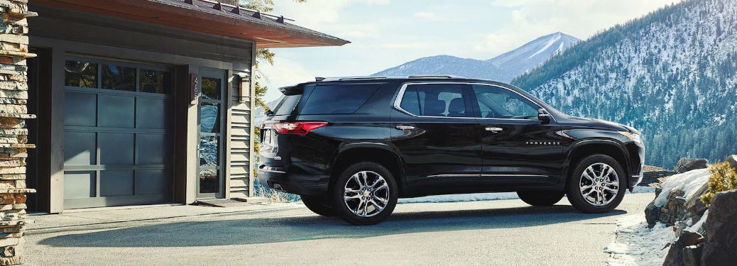 Passenger side exterior view of a black 2019 Chevy Traverse