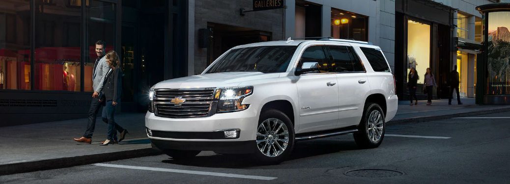 Driver side exterior view of a white 2019 Chevy Tahoe
