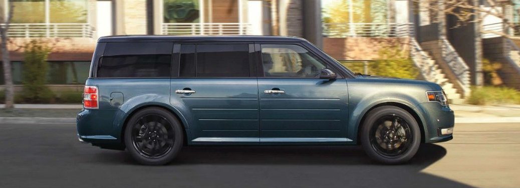 Passenger side exterior view of a blue 2019 Ford Flex
