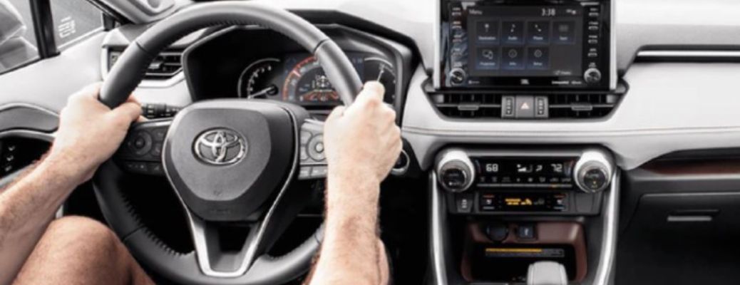 Hands of a man driving