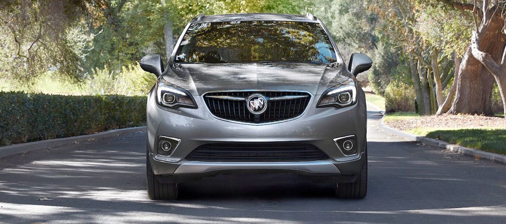 2020 Buick Envision on road with hedges from exterior front view