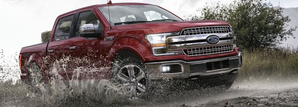 2020 Ford F-150 Lariat SuperCrew driving through mud
