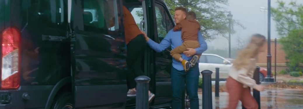 family getting out of the ford transit
