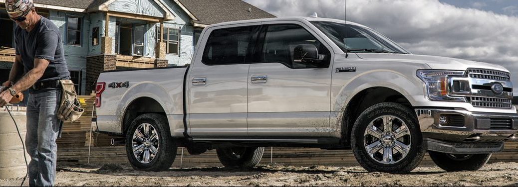 A 2020 Ford F-150 equipped with a SuperCrew cab sits on a worksite.