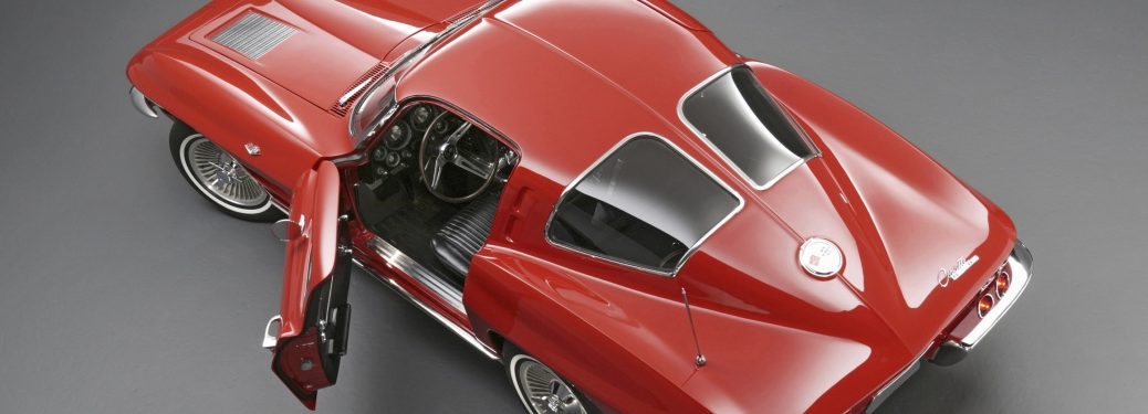Top down view of a classic red Corvette with an open, inviting door