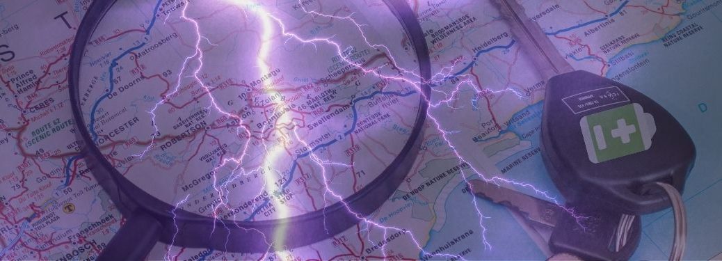 A map is laid out, overlaid with lightning bolts, for planning a road trip in an EV