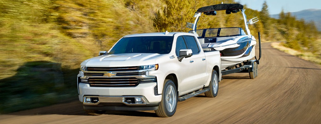 White 2020 Chevy Silverado tows a boat