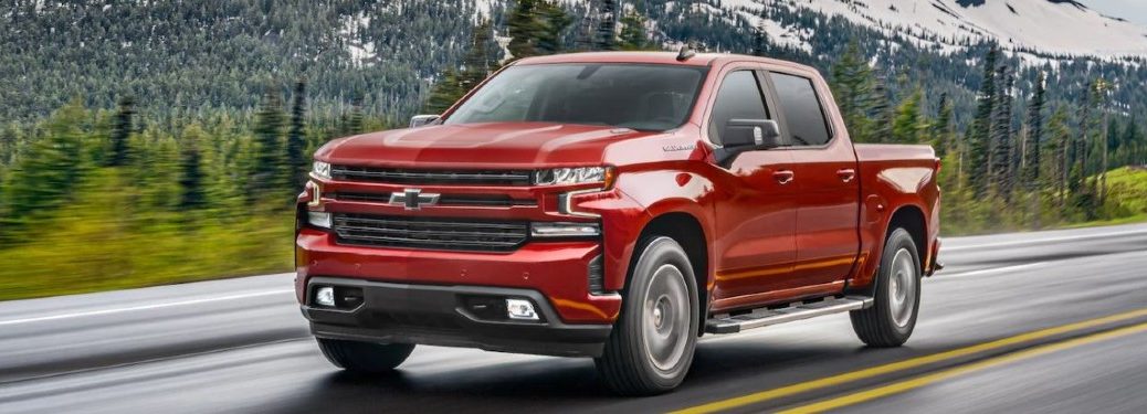 red 2021 Chevrolet Silverado driving down the road
