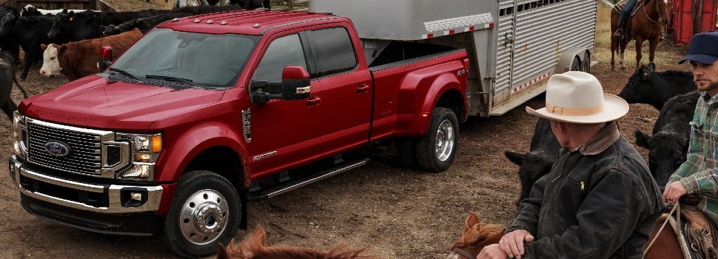 Man on a horse admires the spiffy color of a 2021 Ford Super Duty