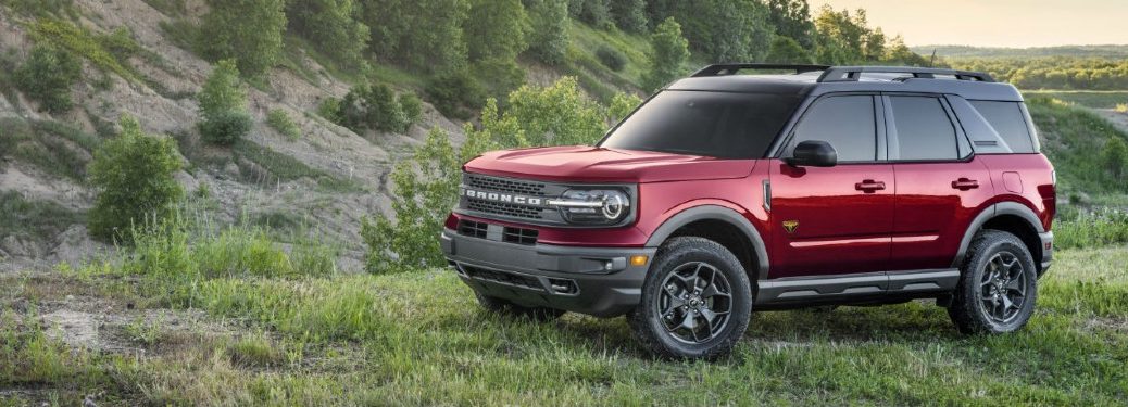 red 2021 Ford Bronco Sport grazes in a grassy field