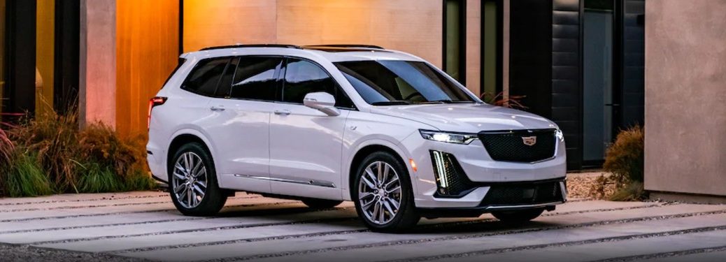 Front passenger angle of a white 2021 Cadillac XT6
