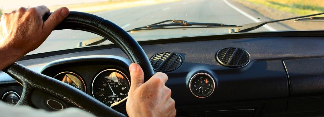Driver behind the wheel of a car