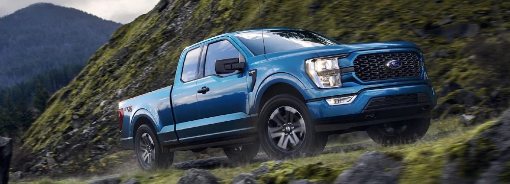 Front passenger angle of a blue 2021 Ford F-150