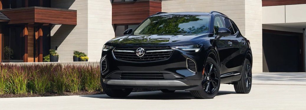 Front driver angle of a dark blue 2021 Buick Envision