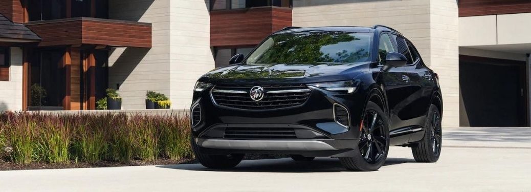 2021 Buick Envision parked by a house.