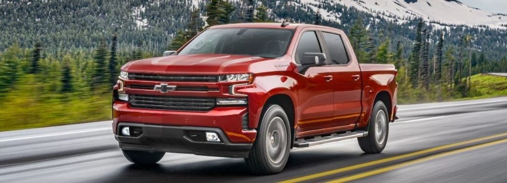 A red 2021 Chevrolet Silverado on the road.