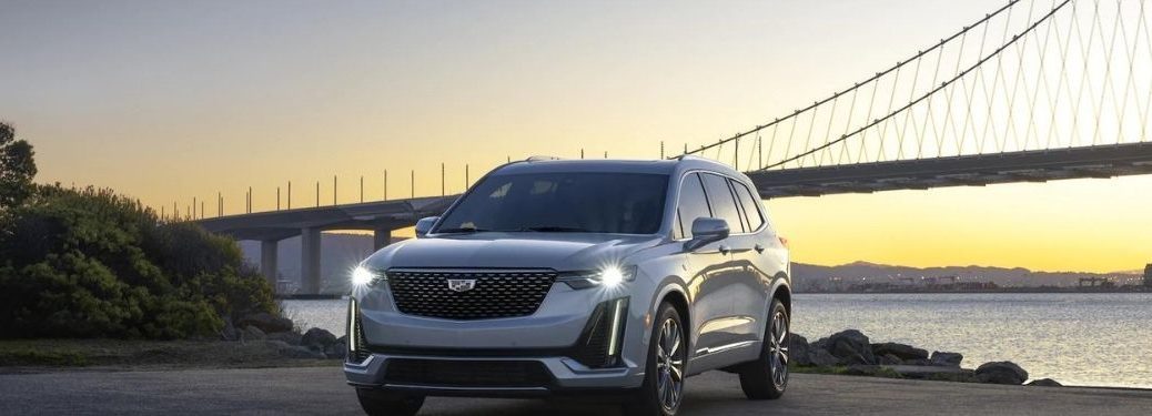 2021 Cadillac XT6 parked in front of a bridge