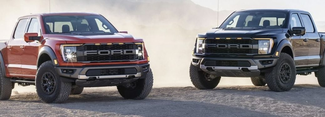 Red and Black 2021 Ford F-150 parked next to each other.