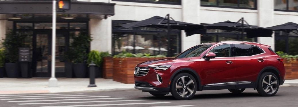 A red 2021 Buick Envision at the traffic intersection.