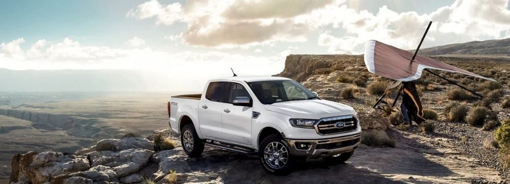 A white 2021 Ford Ranger parked on the edge of a rocky mountain.