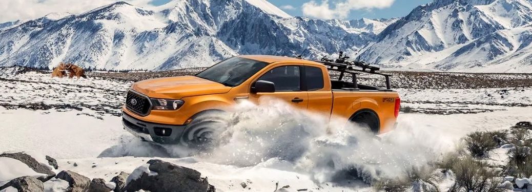 A 2021 Ford Ranger driving on snowy terrain.