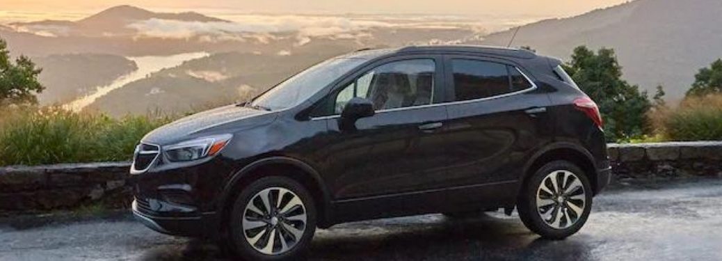The side view of the 2021 Buick Encore parked against a landscape.