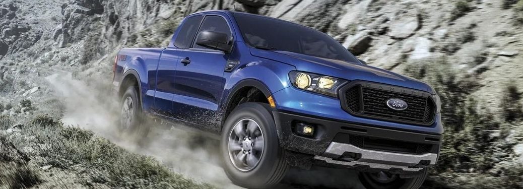 A blue 2022 Ford Ranger descending a rocky terrain