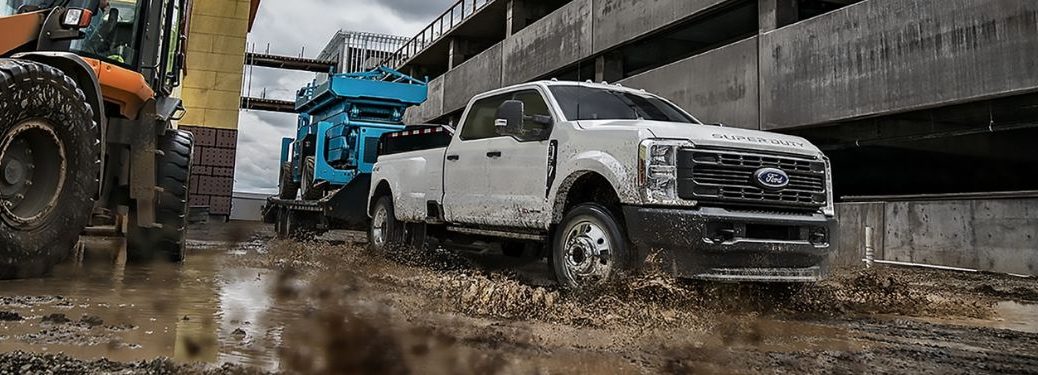 A 2023 Ford Super Duty on a muddy terrain