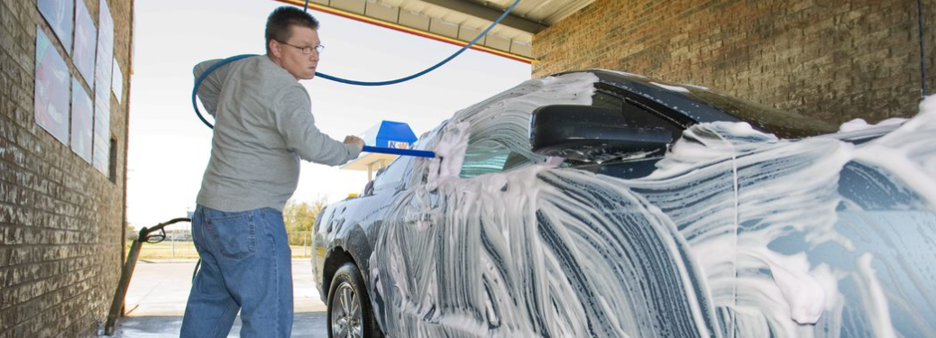 Man cleaning a vehicle