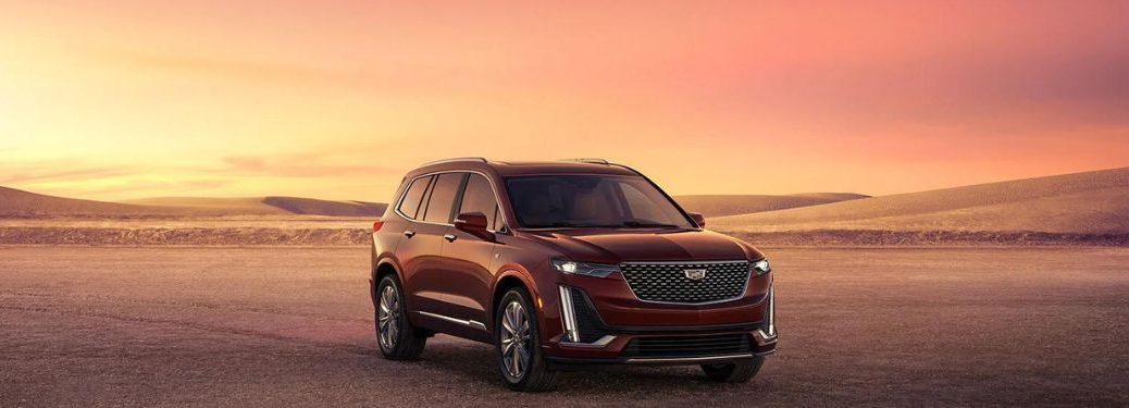 2023 Cadillac XT6 Red parked in an open field