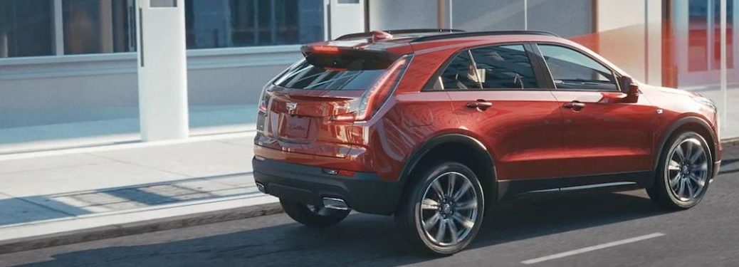 Back view of the 2023 Cadillac XT4 parked outside a building.