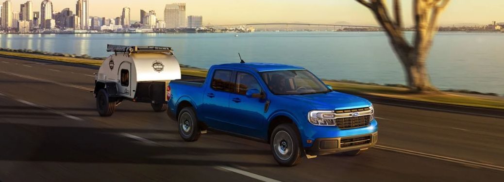 A 2023 Ford Maverick towing a small trailer