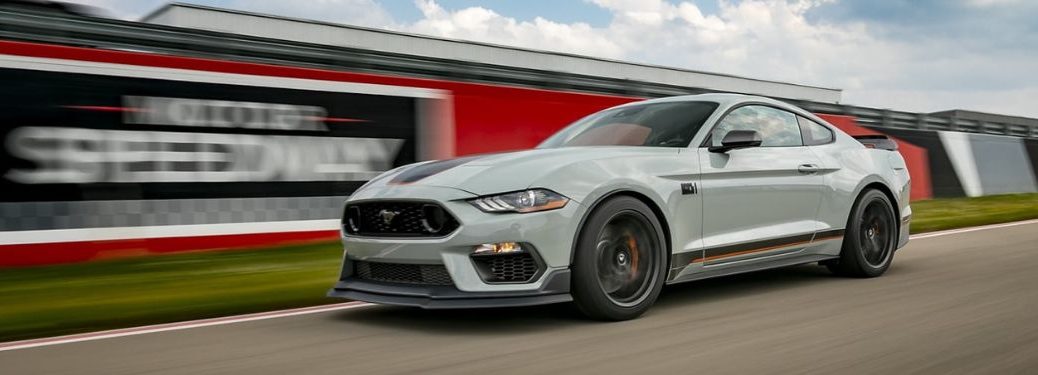 A grey 2023 Ford Mustang on the race track.