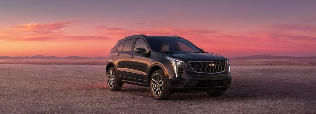 An image of the side view of a dark maroon colored 2023 Cadillac XT4