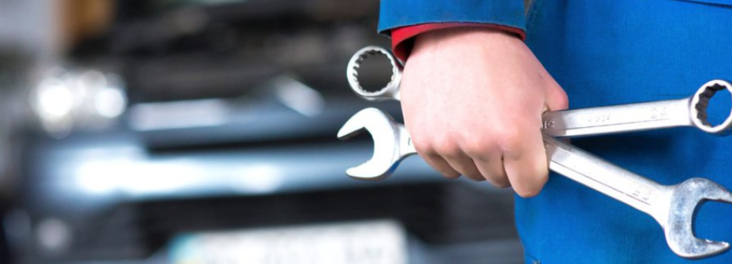 Technician holding tools