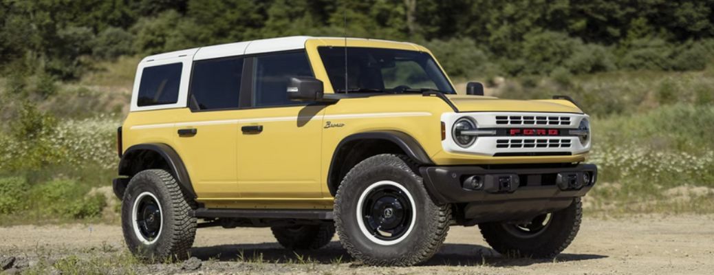One yellow coloured 2023 Ford Bronco is parked.